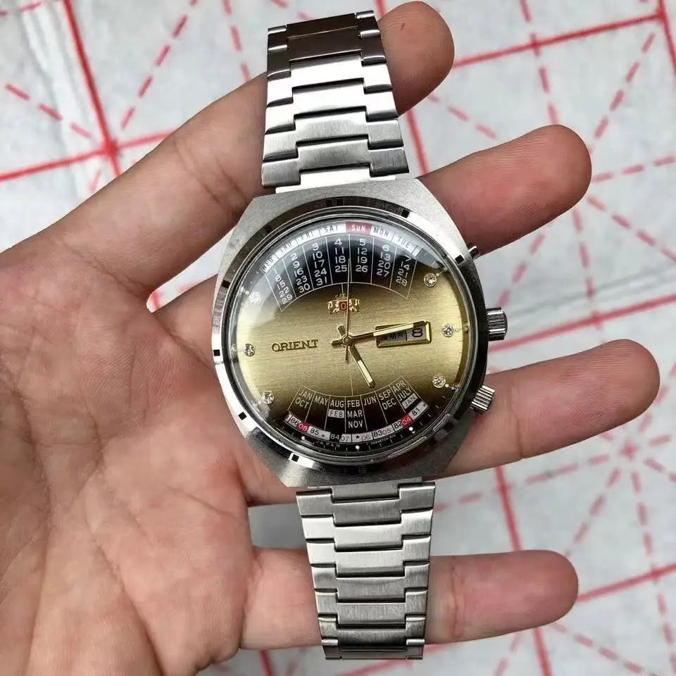 automatic mechanical unisex Orient watch with large rotating dial, fully functional stainless steel Japanese movement