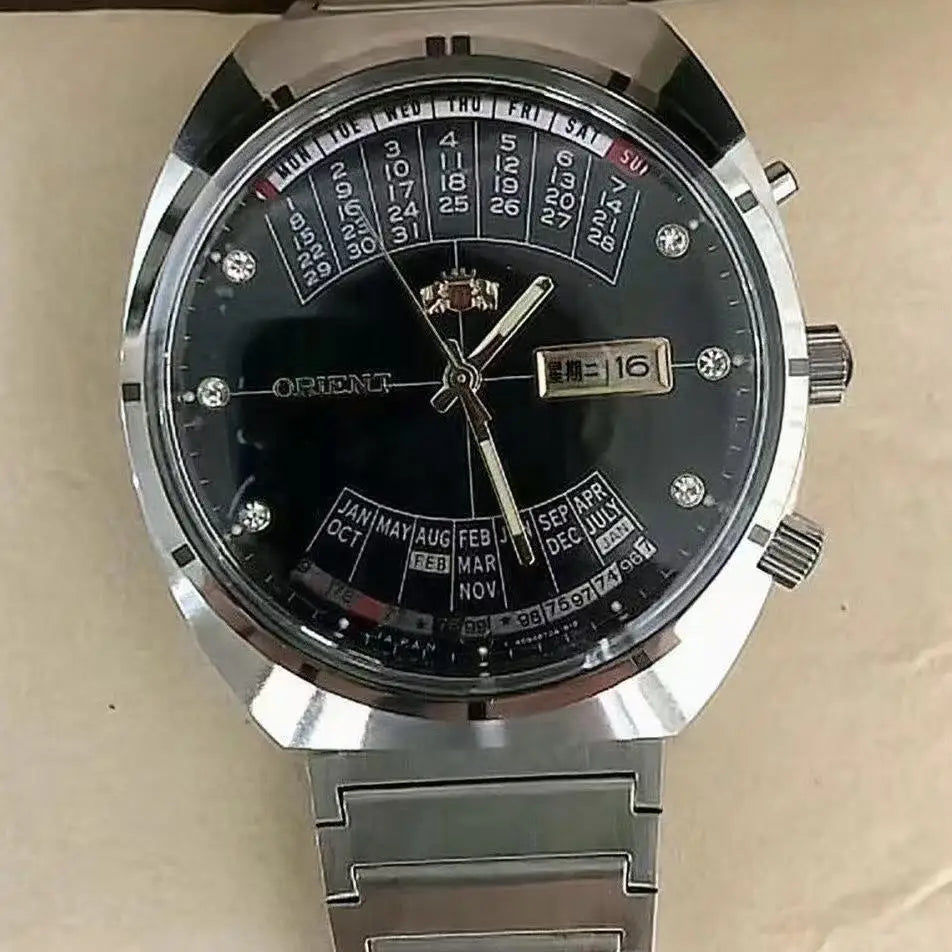 automatic mechanical unisex Orient watch with large rotating dial, fully functional stainless steel Japanese movement