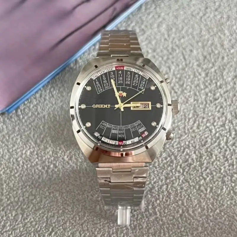 automatic mechanical unisex Orient watch with large rotating dial, fully functional stainless steel Japanese movement